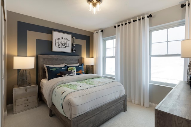 carpeted bedroom with baseboards