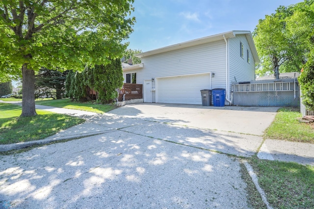 929 16th St N, Moorhead, MN 56560 - view of front of home featuring driveway and an attached garage