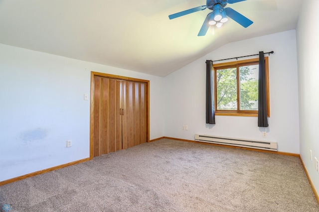 929 16th St N, Moorhead, MN 56560 - unfurnished bedroom with baseboard heating, lofted ceiling, carpet floors, a closet, and baseboards