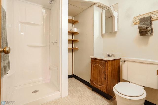 929 16th St N, Moorhead, MN 56560 - bathroom featuring vanity, a walk in shower, toilet, and tile patterned floors