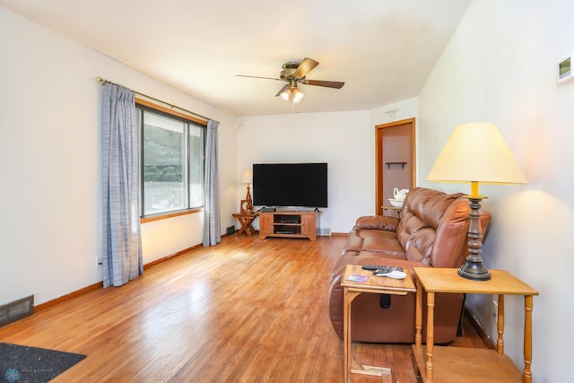929 16th St N, Moorhead, MN 56560 - living room with a ceiling fan, wood finished floors, and baseboards