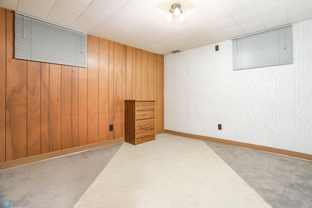 929 16th St N, Moorhead, MN 56560 - finished below grade area featuring carpet flooring, wood walls, and baseboards