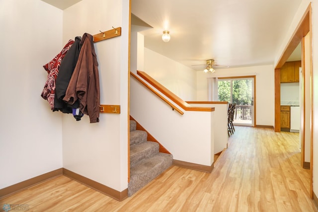 929 16th St N, Moorhead, MN 56560 - staircase featuring wood finished floors, baseboards, and a ceiling fan
