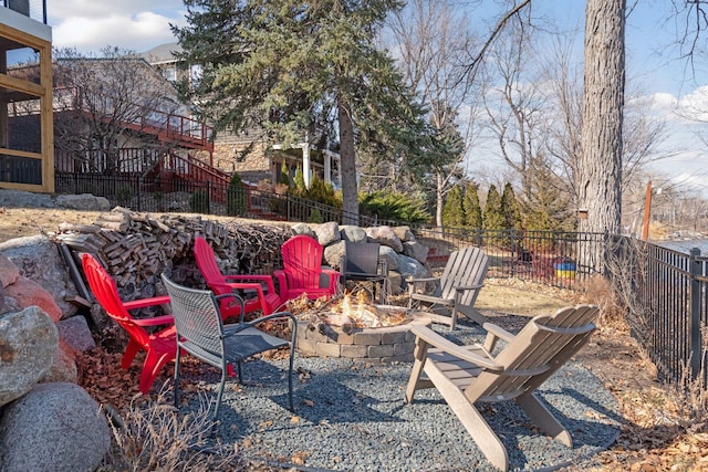 view of yard featuring fence and an outdoor fire pit