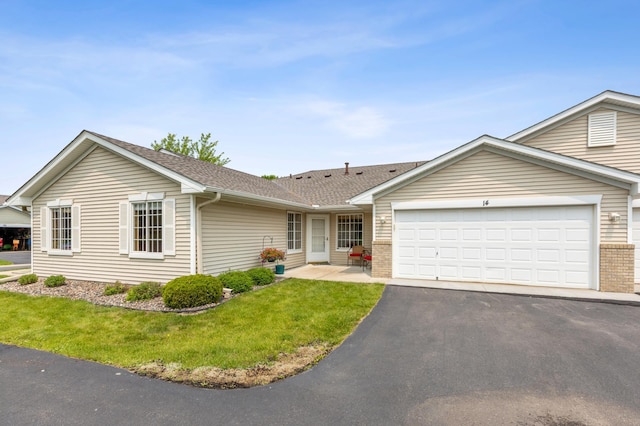 14 3rd St NW, Saint Michael, MN 55376 - ranch-style home with asphalt driveway, an attached garage, a front lawn, brick siding, and roof with shingles