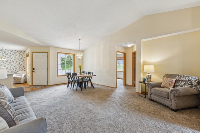 14 3rd St NW, Saint Michael, MN 55376 - carpeted living room featuring a chandelier, lofted ceiling, and baseboards