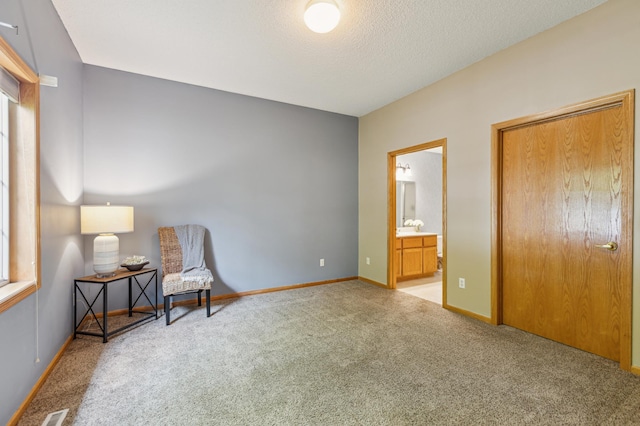 14 3rd St NW, Saint Michael, MN 55376 - living area featuring light carpet, baseboards, and a textured ceiling