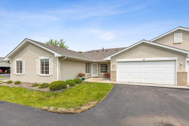 14 3rd St NW, Saint Michael, MN 55376 - single story home featuring asphalt driveway, a garage, a front yard, brick siding, and roof with shingles