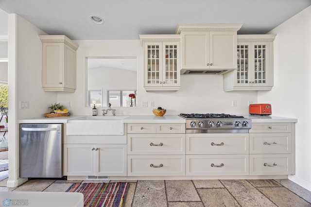 kitchen featuring appliances with stainless steel finishes, cream cabinets, light countertops, plenty of natural light, and recessed lighting