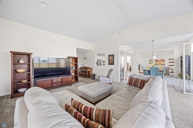 living area with light carpet and vaulted ceiling