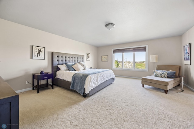 carpeted bedroom with baseboards
