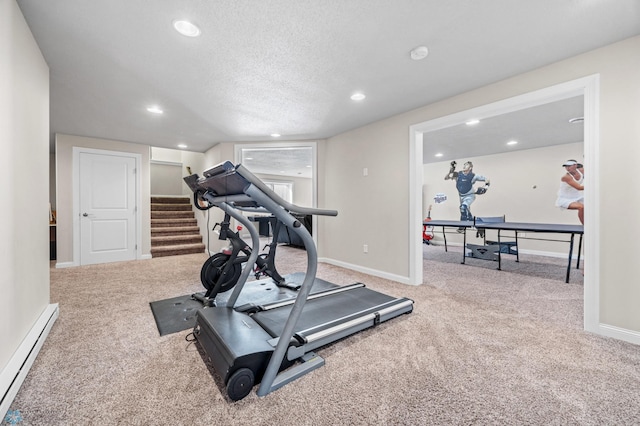 workout area featuring a baseboard heating unit, carpet flooring, recessed lighting, a textured ceiling, and baseboards