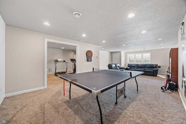 game room with carpet floors, recessed lighting, baseboards, and a textured ceiling