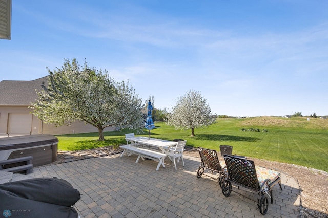 view of patio / terrace featuring a hot tub and outdoor dining space