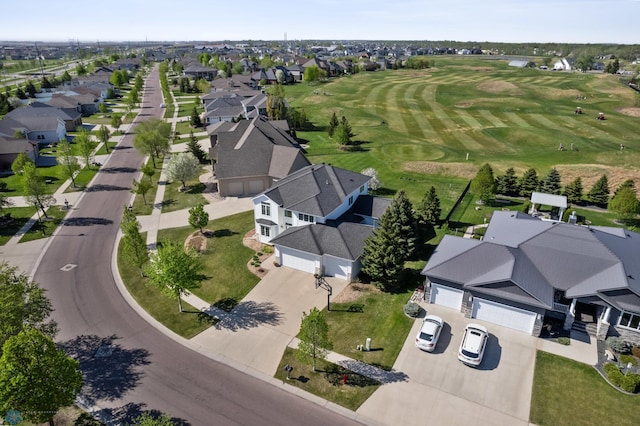 aerial view of residential area featuring a local golf course