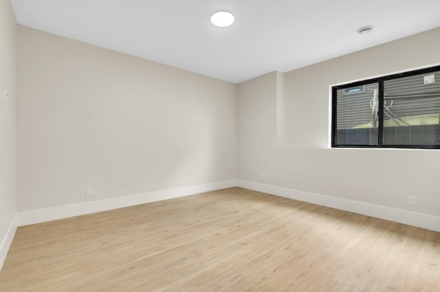 11694 Indian Beach Rd, Spicer, MN 56288 - empty room with light wood-style floors and baseboards
