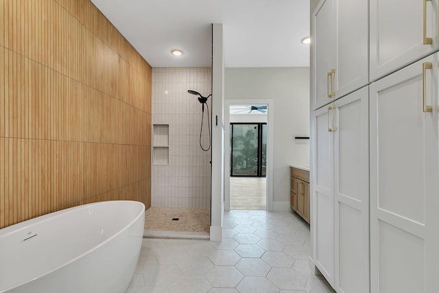11694 Indian Beach Rd, Spicer, MN 56288 - bathroom featuring a tile shower, a freestanding tub, tile patterned flooring, ceiling fan, and recessed lighting