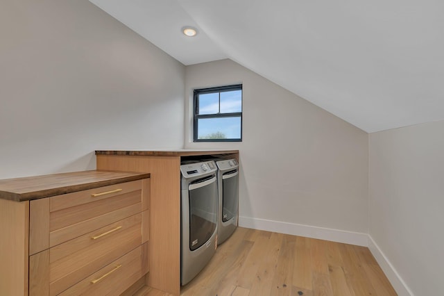 11694 Indian Beach Rd, Spicer, MN 56288 - laundry area with washer and dryer and light wood-type flooring