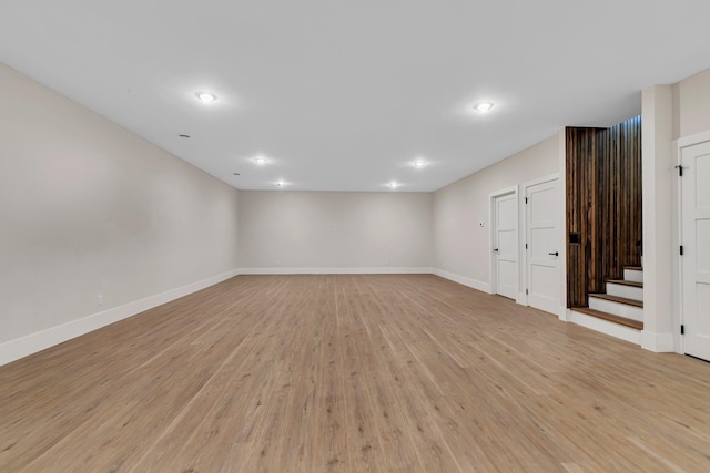 11694 Indian Beach Rd, Spicer, MN 56288 - below grade area featuring light wood-style flooring, recessed lighting, and stairs