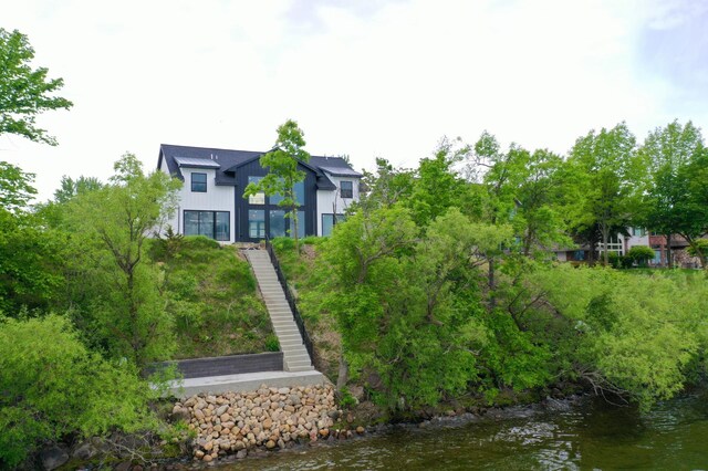 11694 Indian Beach Rd, Spicer, MN 56288 - back of property featuring a water view and stairway