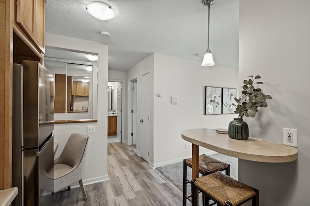 3729 Snelling Ave Unit 203, Minneapolis, MN 55406 - interior space featuring light wood-style flooring, baseboards, and a textured ceiling