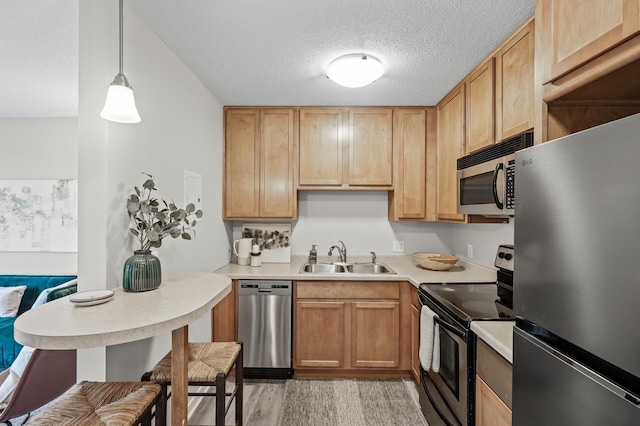 3729 Snelling Ave Unit 203, Minneapolis, MN 55406 - kitchen with a sink, light wood-type flooring, light countertops, and appliances with stainless steel finishes