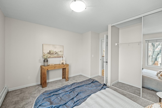 3729 Snelling Ave Unit 203, Minneapolis, MN 55406 - unfurnished bedroom with a textured ceiling, a closet, carpet floors, baseboard heating, and baseboards