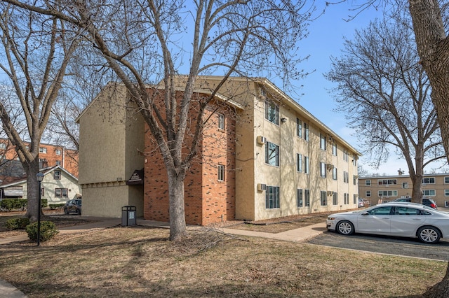 3729 Snelling Ave Unit 203, Minneapolis, MN 55406 - view of building exterior featuring uncovered parking