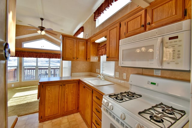 18096 Browns Lake Rd # 17, Richmond, MN 56368 - kitchen with light countertops, white appliances, a ceiling fan, a sink, and vaulted ceiling