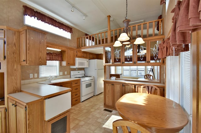18096 Browns Lake Rd # 17, Richmond, MN 56368 - kitchen with light countertops, a sink, a chandelier, a peninsula, and white appliances