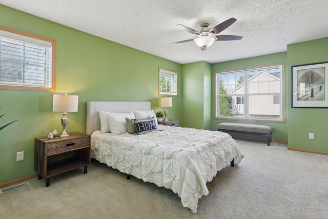 9512 Scott Ln N, Brooklyn Park, MN 55443 - bedroom featuring carpet, a textured ceiling, baseboards, and a ceiling fan
