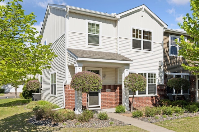 9512 Scott Ln N, Brooklyn Park, MN 55443 - townhome / multi-family property with brick siding and a shingled roof