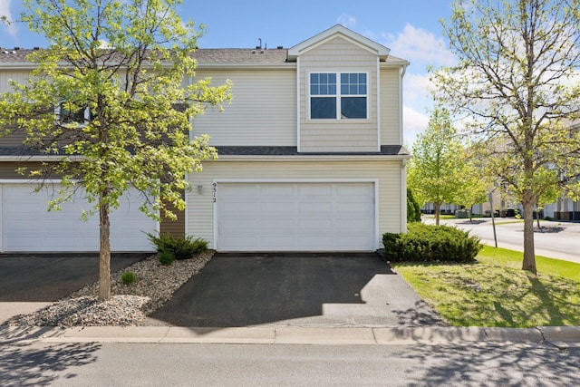 9512 Scott Ln N, Brooklyn Park, MN 55443 - view of front of property with asphalt driveway, a garage, and a shingled roof