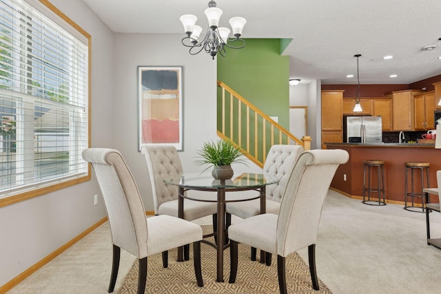 9512 Scott Ln N, Brooklyn Park, MN 55443 - dining room with light carpet, a chandelier, healthy amount of natural light, and recessed lighting