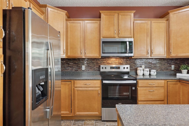 9512 Scott Ln N, Brooklyn Park, MN 55443 - kitchen featuring appliances with stainless steel finishes, decorative backsplash, a textured ceiling, and dark countertops