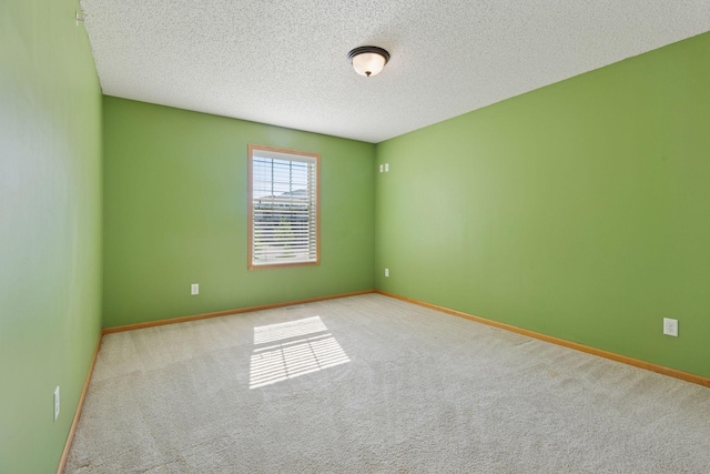 9512 Scott Ln N, Brooklyn Park, MN 55443 - unfurnished room featuring carpet, a textured ceiling, and baseboards