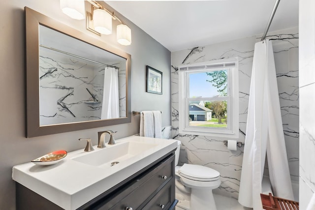 full bathroom with tile walls, vanity, toilet, marble finish flooring, and a shower with curtain