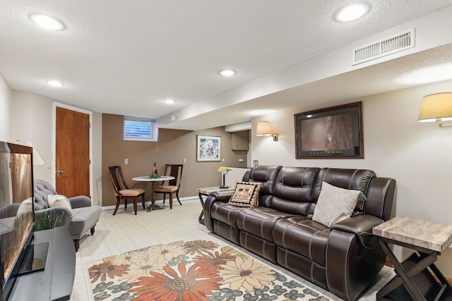 living room with baseboards, light colored carpet, recessed lighting, and a textured ceiling