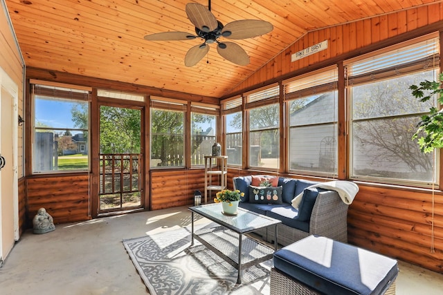 sunroom / solarium featuring vaulted ceiling, plenty of natural light, a ceiling fan, and outdoor lounge area
