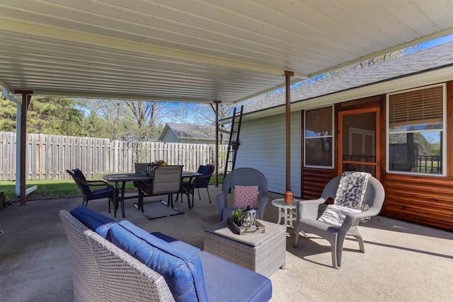 view of patio / terrace featuring outdoor dining space, a fenced backyard, and an outdoor living space