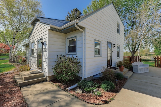 view of property exterior featuring fence