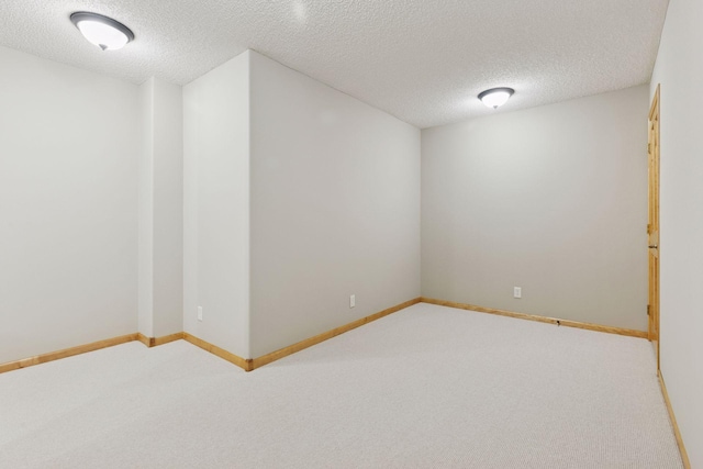 11871 Flanders Cir NE, Blaine, MN 55449 - unfurnished room featuring carpet and a textured ceiling
