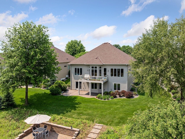 11871 Flanders Cir NE, Blaine, MN 55449 - rear view of house with a patio, a deck, a lawn, and roof with shingles