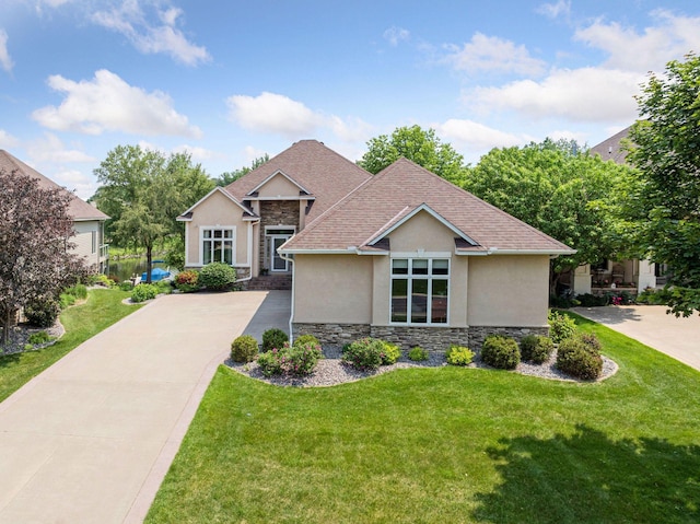 11871 Flanders Cir NE, Blaine, MN 55449 - view of front of property featuring stucco siding, stone siding, a front lawn, and roof with shingles