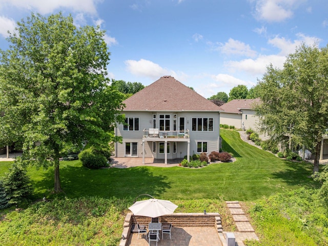 11871 Flanders Cir NE, Blaine, MN 55449 - back of house featuring a patio, a lawn, a wooden deck, and roof with shingles