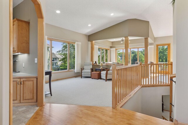 11871 Flanders Cir NE, Blaine, MN 55449 - hall featuring an upstairs landing, lofted ceiling, plenty of natural light, recessed lighting, and light colored carpet