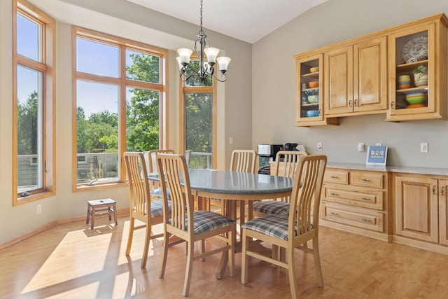 11871 Flanders Cir NE, Blaine, MN 55449 - dining space featuring light wood-type flooring and a chandelier