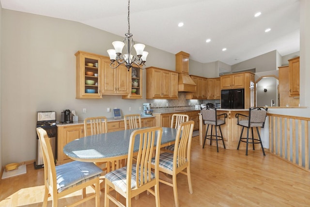 11871 Flanders Cir NE, Blaine, MN 55449 - dining area with vaulted ceiling, light wood-style flooring, recessed lighting, and a chandelier