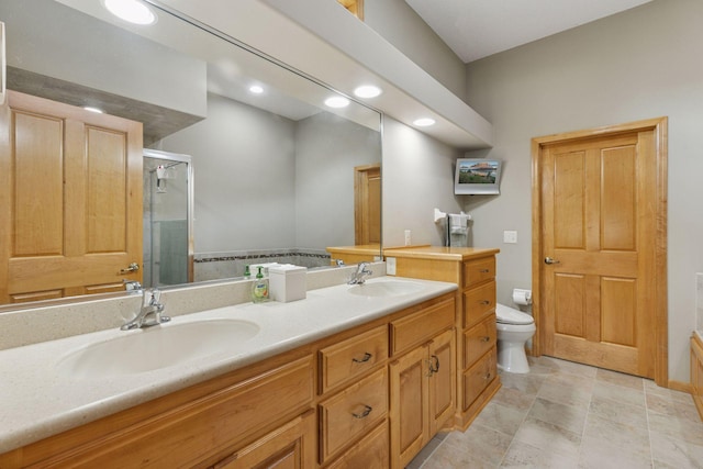 11871 Flanders Cir NE, Blaine, MN 55449 - bathroom with double vanity, a shower stall, and recessed lighting