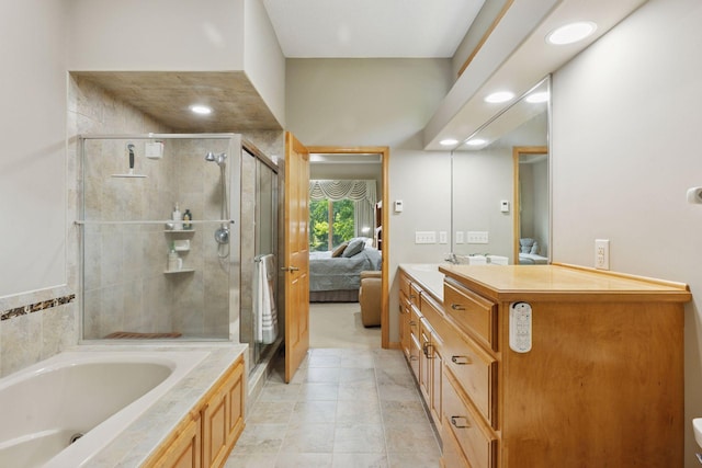 11871 Flanders Cir NE, Blaine, MN 55449 - full bathroom with connected bathroom, a shower stall, a jetted tub, vanity, and recessed lighting